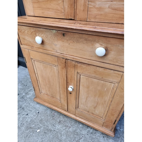 1017 - A Victorian pine secretaire cabinet, with white pottery knobs, 95cm wide.