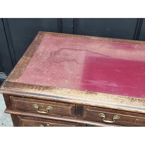 1019 - An old oak pedestal desk, 137cm wide.