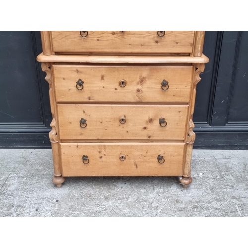 1022 - A pair of late 19th century Continental pine three drawer chests, 84.5cm wide, (one lacking feet). (... 