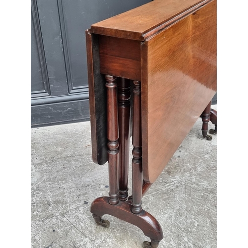 1026 - A Victorian rosewood Sutherland table, 90cm wide.