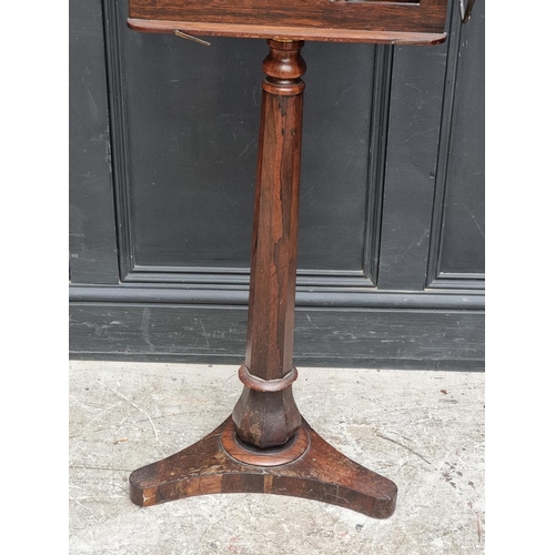 1028 - A William IV rosewood duet stand, with brass candle branches, 44.5cm wide, (s.d.).... 