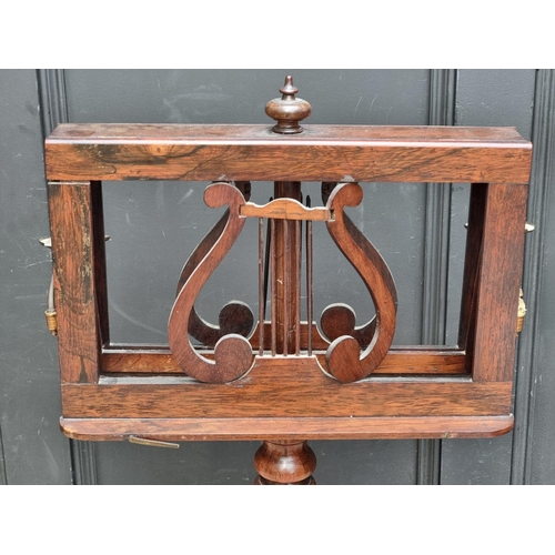 1028 - A William IV rosewood duet stand, with brass candle branches, 44.5cm wide, (s.d.).... 