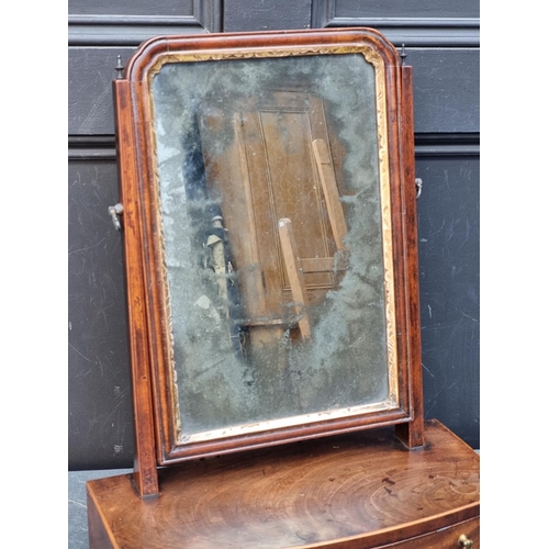 1029 - An 18th century mahogany and line inlaid bowfront toilet mirror, 38.5cm wide.