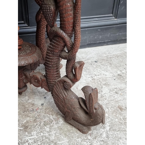 1031 - A late 19th century Anglo-Indian carved hardwood occasional table, 59cm wide.