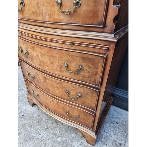 1035 - A small reproduction walnut and crossbanded chest on chest, 73.5cm wide.