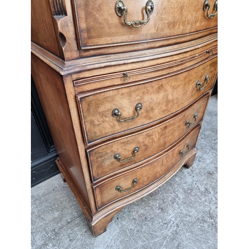 1035 - A small reproduction walnut and crossbanded chest on chest, 73.5cm wide.