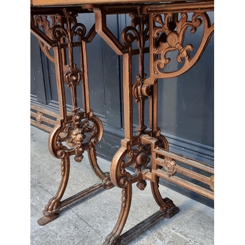 1037 - A pair of copper topped cast iron rectangular occasional tables, 99cm wide.