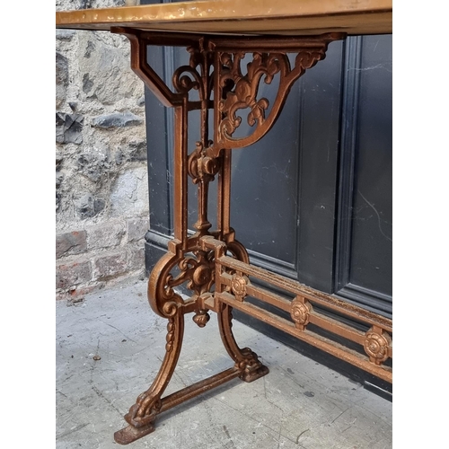 1037 - A pair of copper topped cast iron rectangular occasional tables, 99cm wide.