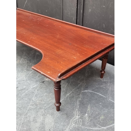 1040 - An old mahogany bed table/tray, 73.5cm wide.