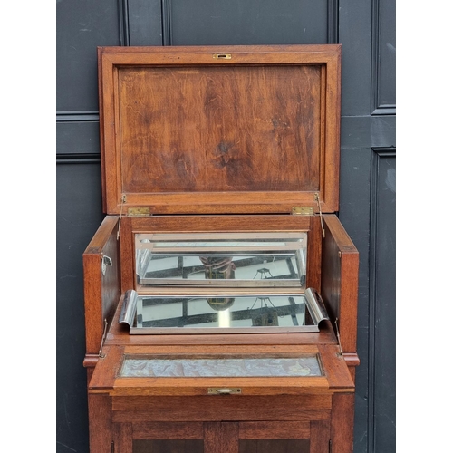 1041 - A 1930s Continental mahogany and walnut drinks cabinet, with hinged top, 69cm wide.... 