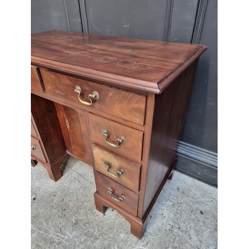 1042 - A mahogany kneehole chest, 84cm wide.