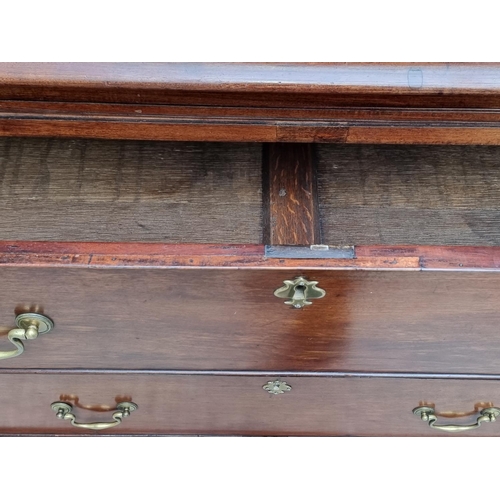 1044 - A George III mahogany chest of drawers, with brushing slide, 110cm wide.