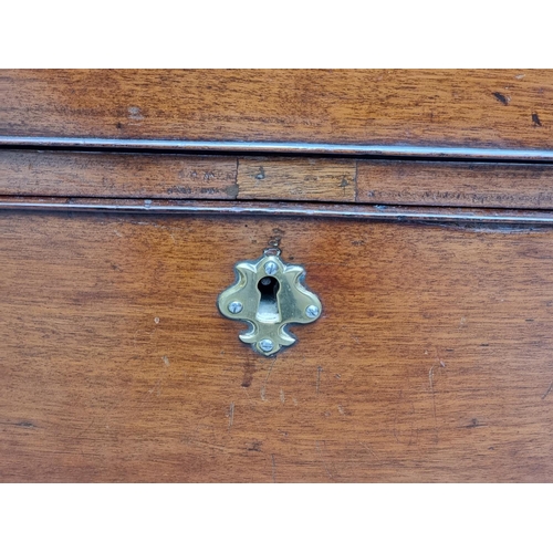 1044 - A George III mahogany chest of drawers, with brushing slide, 110cm wide.