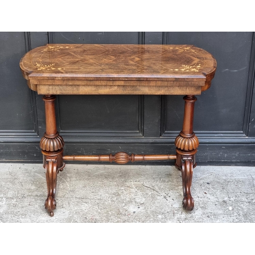 1045 - A Victorian rosewood and inlaid card table, 92cm wide.