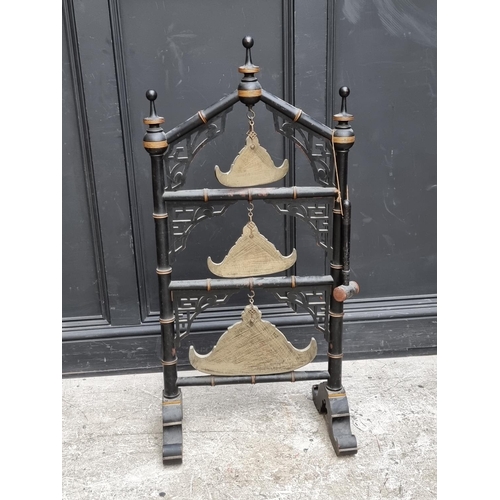 1048 - An ebonized simulated bamboo Tibetan temple gong stand, 104.5cm high, with beater.... 