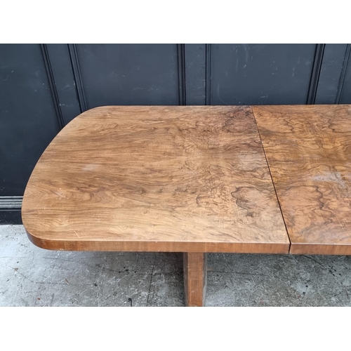 1049 - An Art Deco figured walnut extending dining table and four matching chairs, the table 212cm ext... 