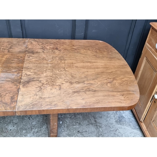 1049 - An Art Deco figured walnut extending dining table and four matching chairs, the table 212cm ext... 