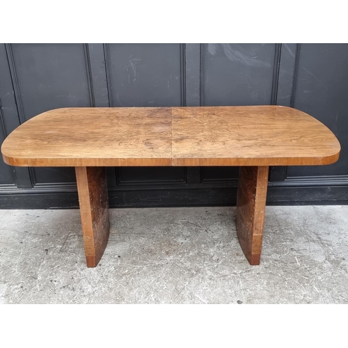 1049 - An Art Deco figured walnut extending dining table and four matching chairs, the table 212cm ext... 