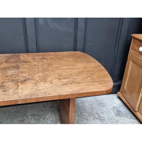 1049 - An Art Deco figured walnut extending dining table and four matching chairs, the table 212cm ext... 