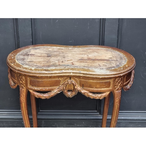 1050 - A Louis XV style giltwood writing table, 77cm wide, (lacking inset surface).