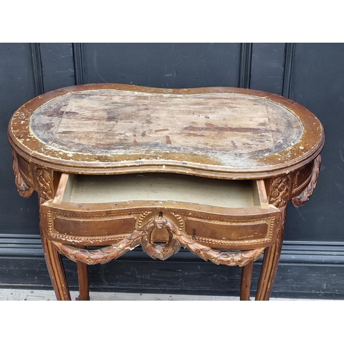 1050 - A Louis XV style giltwood writing table, 77cm wide, (lacking inset surface).