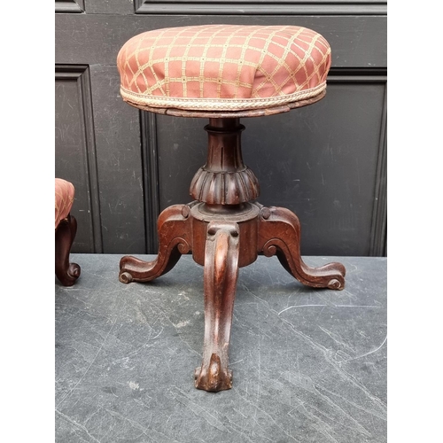 1051 - A Victorian walnut adjustable piano stool, (mechanism a.f.); together with another Victorian wa... 