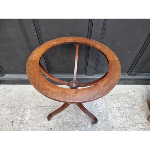 1053 - An early Victorian mahogany tripod globe stand, the aperture 46.5cm.