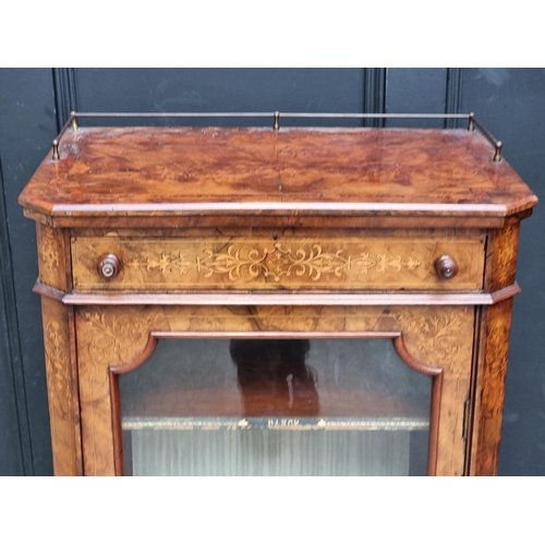 1055 - A Victorian figured walnut and inlaid music cabinet, 60.5cm wide.