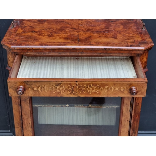 1055 - A Victorian figured walnut and inlaid music cabinet, 60.5cm wide.