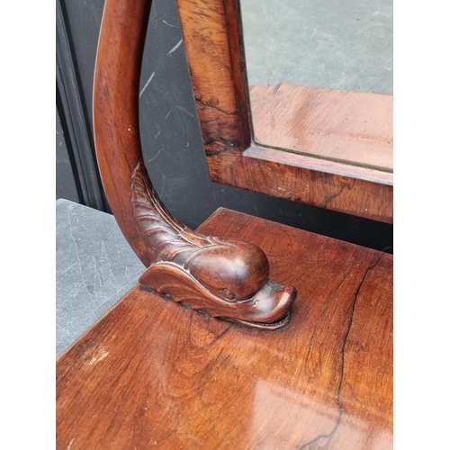 1059 - An unusual Victorian rosewood toilet mirror, with dolphin supports, 67cm wide.