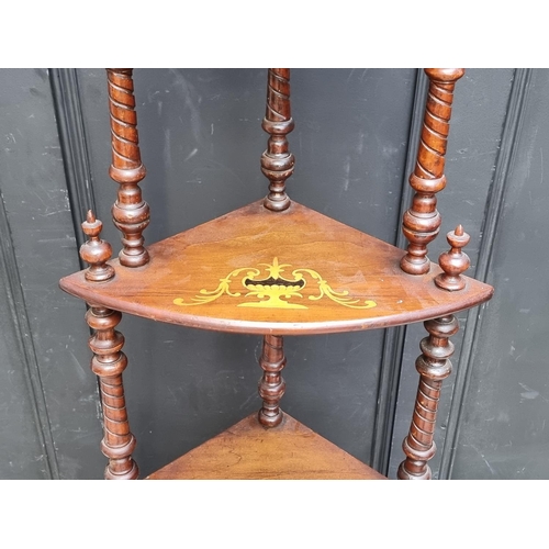 1061 - A Victorian walnut and inlaid corner whatnot, 144.5cm high.