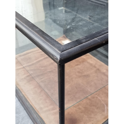 1063 - An ebonized table top display case, 39cm high x 58cm wide x 45.5cm deep.