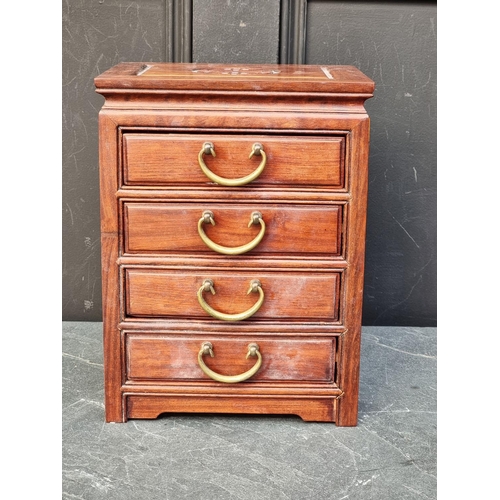 1064 - A miniature Chinese hardwood four drawer chest, 30.5cm high x 23cm wide.