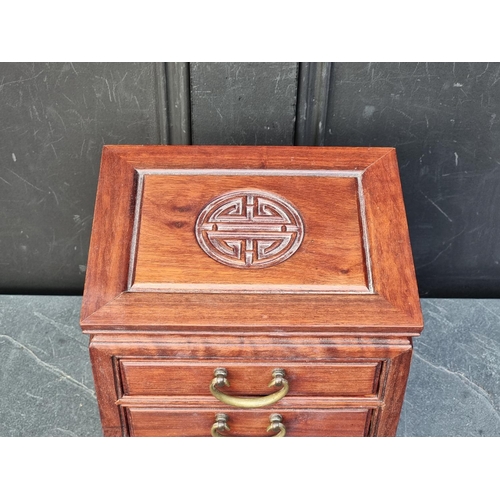 1064 - A miniature Chinese hardwood four drawer chest, 30.5cm high x 23cm wide.