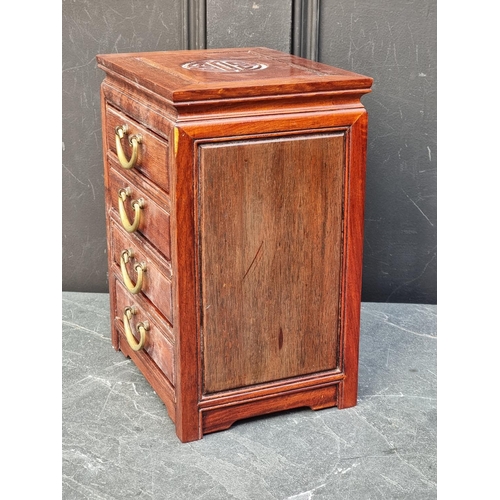 1064 - A miniature Chinese hardwood four drawer chest, 30.5cm high x 23cm wide.