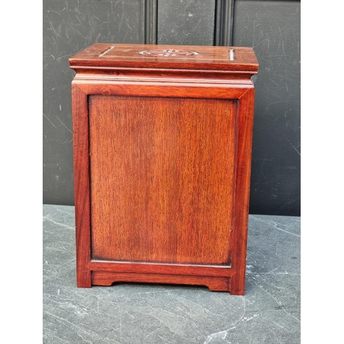 1064 - A miniature Chinese hardwood four drawer chest, 30.5cm high x 23cm wide.