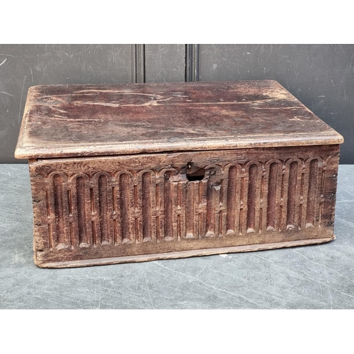 1071 - A late 17th century carved oak boarded bible box, 55cm wide. 