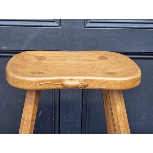 1072 - A Robert 'Mouseman' Thompson four legged cow stool, 37.5cm wide.