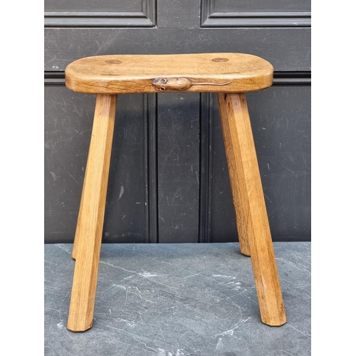 1073 - A Robert 'Mouseman' Thompson four legged cow stool, 37cm wide.