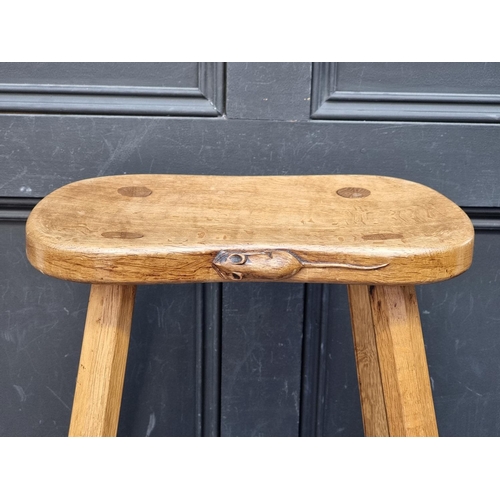 1073 - A Robert 'Mouseman' Thompson four legged cow stool, 37cm wide.