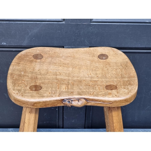 1073 - A Robert 'Mouseman' Thompson four legged cow stool, 37cm wide.