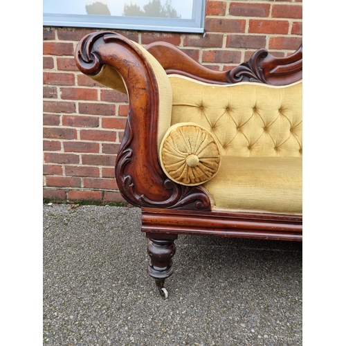 1074 - An early Victorian carved mahogany and button upholstered scroll arm settee, 201cm wide.... 