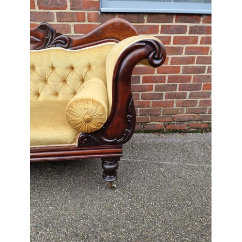 1074 - An early Victorian carved mahogany and button upholstered scroll arm settee, 201cm wide.... 