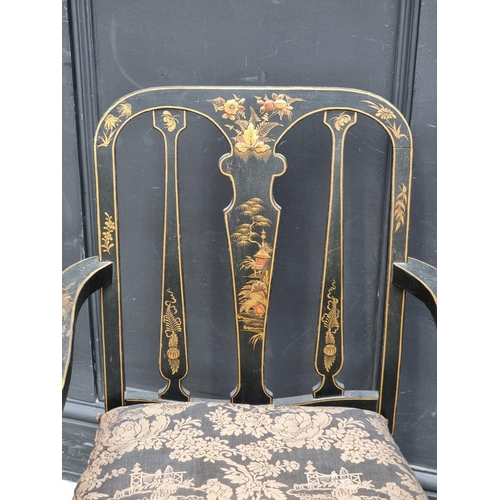 1085 - A 1920s black and gilt chinoiserie open arm low elbow chair.