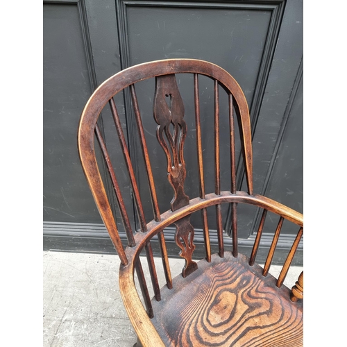 1086 - A 19th century ash and elm Windsor armchair.