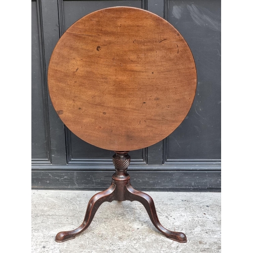 1091 - A George III mahogany circular tilt-top tripod table, with one-piece top and birdcage action, 71.5cm... 