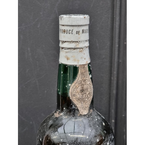 121 - A 75cl bottle of Terra Altas Dao; together with an old bottle 75cl bottle of Madeira; and another bo... 