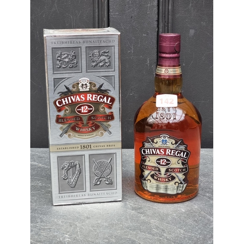 142 - A 1 litre bottle of Chivas Regal 13 year old blended Whisky, in card box. 