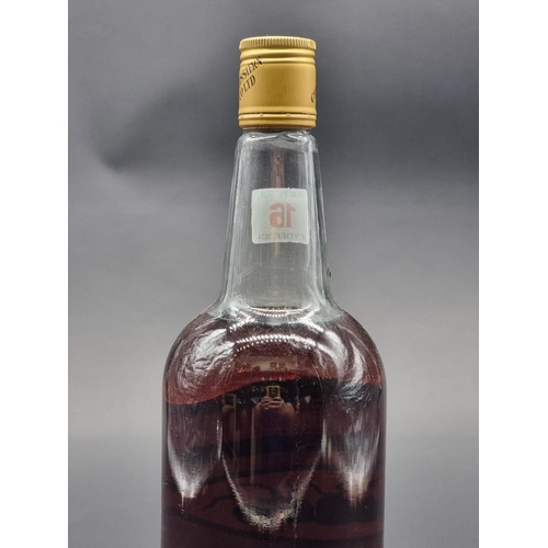 16 - A 1 litre bottle of Four Bells 'Finest Old' Navy Rum, 1970s bottling.