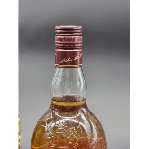 32 - Three bottles of Whisky, comprising: a 1 litre Grant's blended; a 1 litre Bell's blended; and a 70cl... 